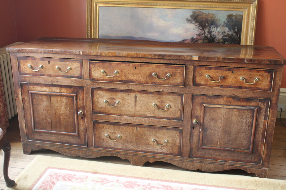 Appraisal: An thC oak dresser base with mahogany cross-banding and an