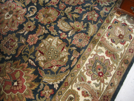 Appraisal: HAND KNOTTED ORIENTAL CARPET Indo-Persian overall floral design on black