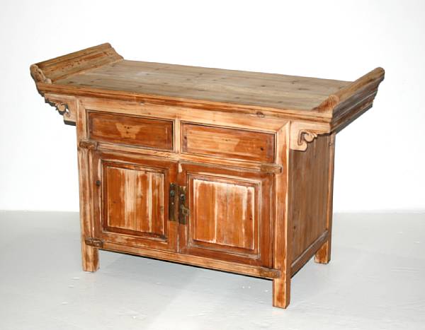 Appraisal: A small soft wood console cabinet with scrolled top panels