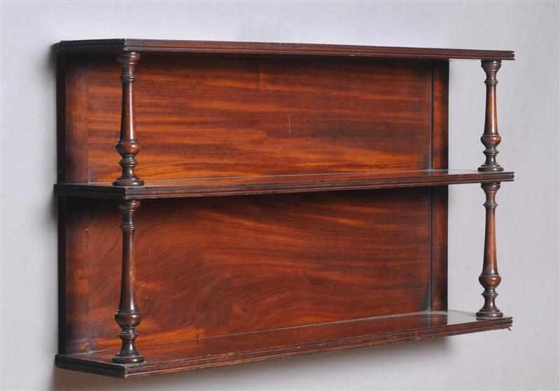 Appraisal: REGENCY MAHOGANY HANGING SHELF The three reeded shelves on vase-turned