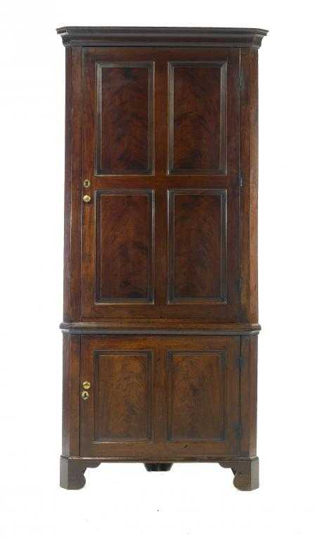 Appraisal: A GEORGE III MAHOGANY CORNER CUPBOARD with cavetto cornice and