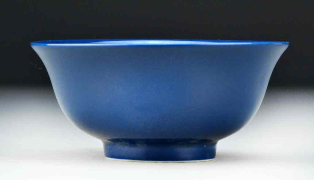 Appraisal: Chinese Monochrome Porcelain BowlHaving deep blue monochrome glaze raised on