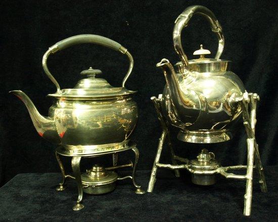 Appraisal: A spherical tea kettle on a crabstock stand with burner