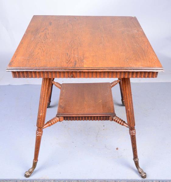 Appraisal: Parlor Table with Claw Feet This parlor table has a