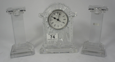 Appraisal: Wedgwood Waterford cutglass clock set with two candlesticks