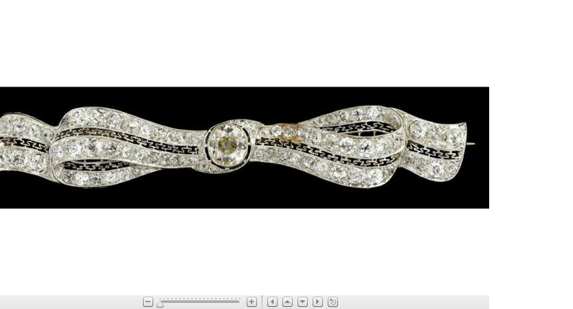 Appraisal: Platinum and diamond ribbon broochUndulating ribbon shape featuring central Old