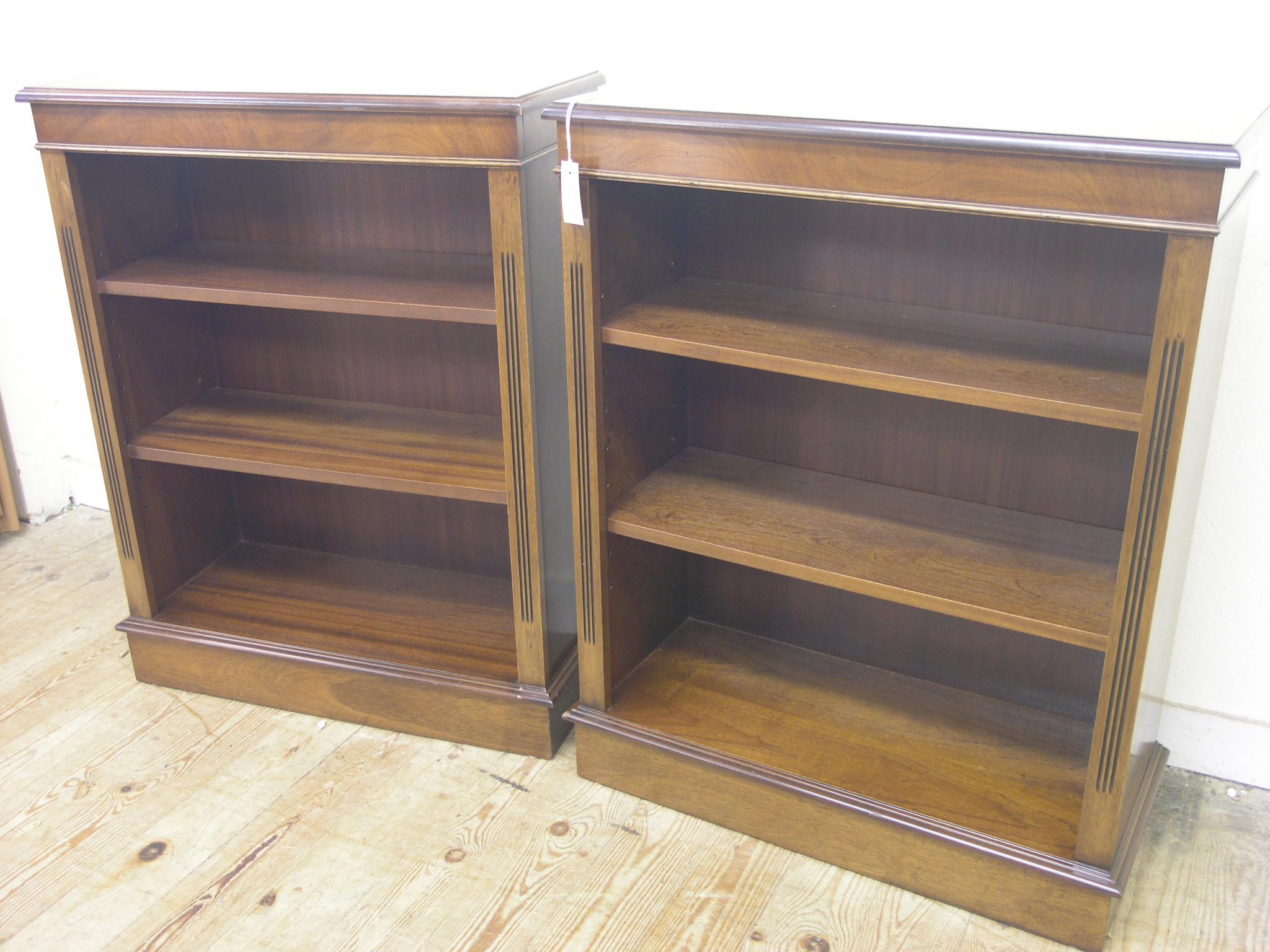 Appraisal: A pair of reproduction mahogany open bookcases two adjustable shelves