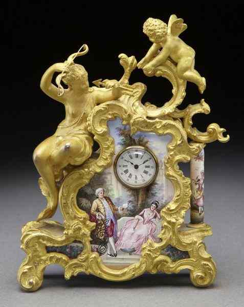 Appraisal: Miniature Limoges porcelain enamel clockdepicitng a courting couple mounted with