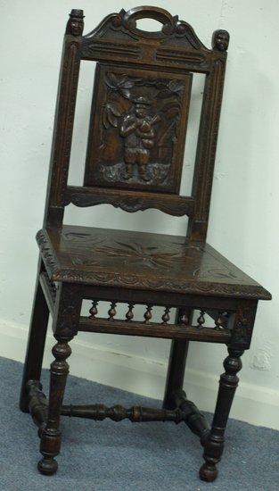 Appraisal: A th Century oak hall chair with carved back and