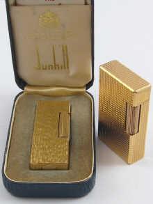 Appraisal: A gold plated Dunhill gas cigarette lighter with bark finish