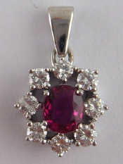 Appraisal: A yellow metal tests carat gold ruby and diamond pendant