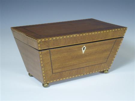 Appraisal: An unusual th century mahogany tea caddy of tapered rectangular