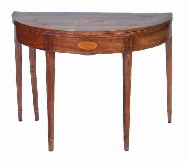 Appraisal: A GEORGE III MAHOGANY FOLD OVER CARD TABLE with conch