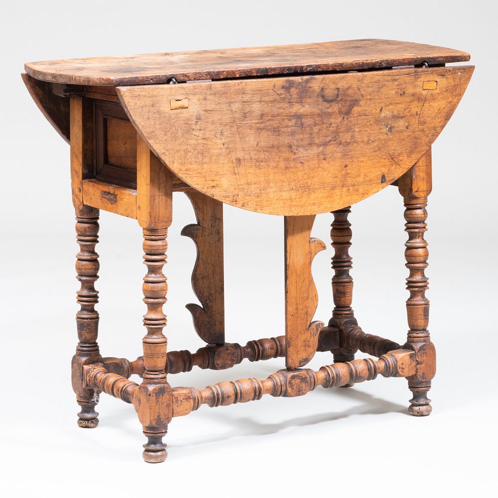 Appraisal: Spanish Baroque Fruitwood Butterfly Table Fitted with a long central