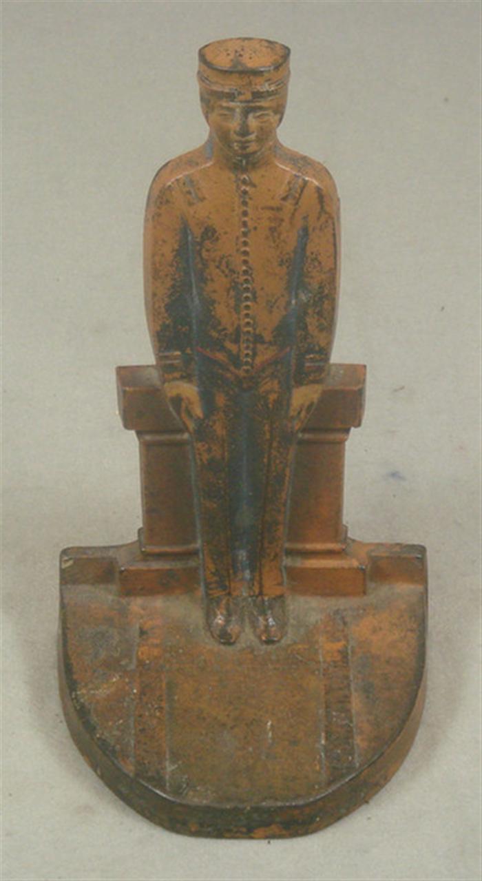 Appraisal: Cast iron doorstop bellhop in uniform stamped on back tall