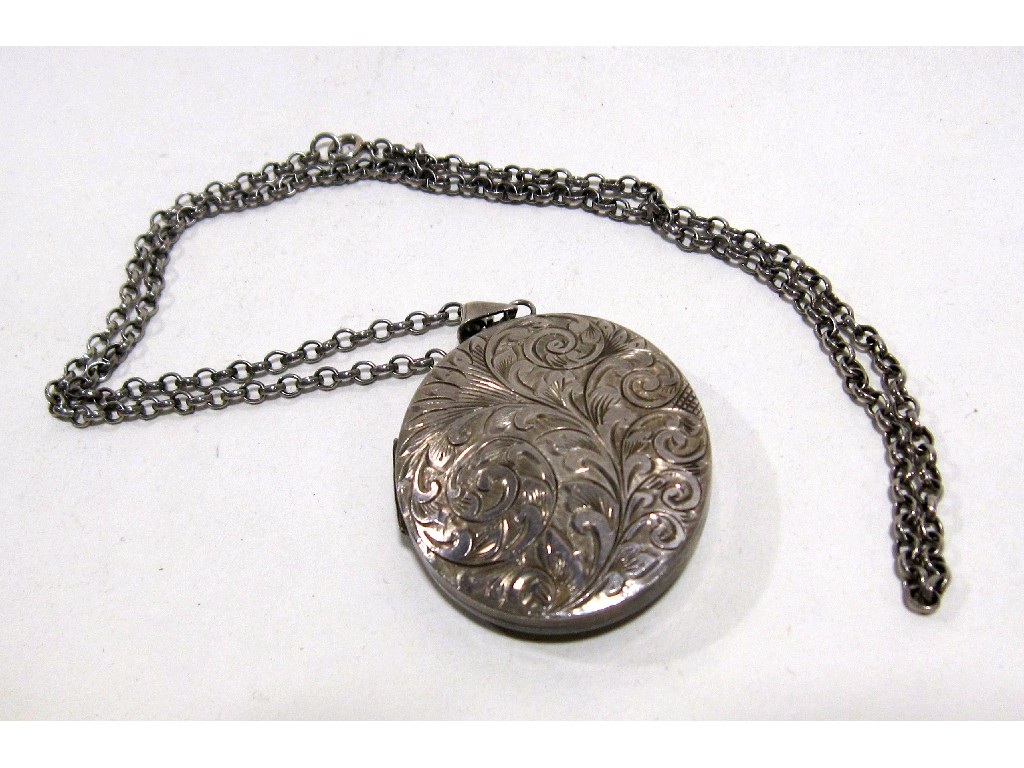 Appraisal: Large engraved silver locket on silver neckchain