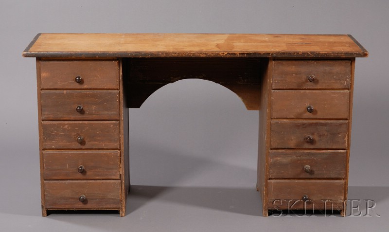 Appraisal: Brown-painted Pine Kneehole Desk New England th century top supported