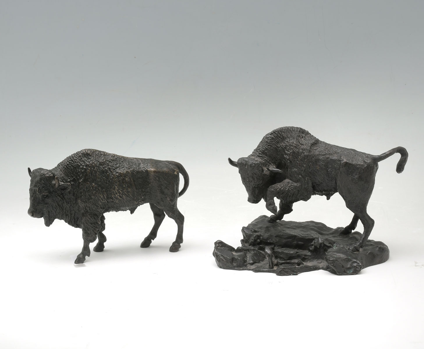 Appraisal: FINELY SCULPTED BUFFALO BRONZES A Standing Bull bronze '' h