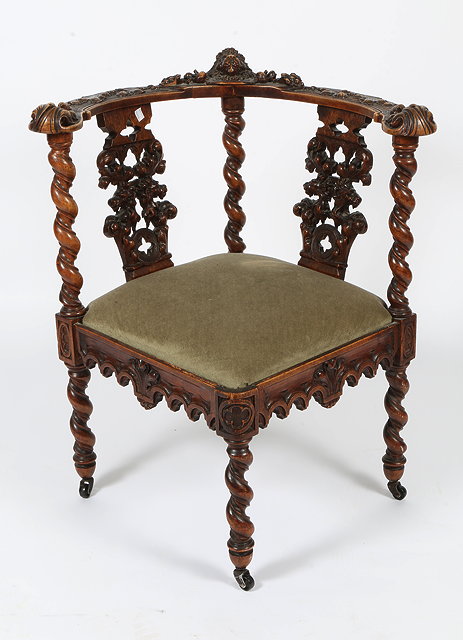 Appraisal: A TH CENTURY CARVED WALNUT CORNER CHAIR decorated with lion