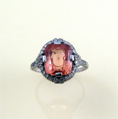 Appraisal: A Belle Epoque padparadscha sapphire and diamond ring c the