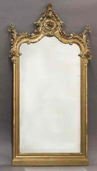 Appraisal: Continental carved gilt framed beveled mirrorthe top with carved flowers