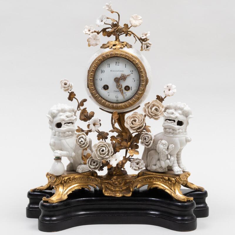 Appraisal: White Glazed Porcelain and Ormolu-Mounted Mantel Clock Mounted with Chinese