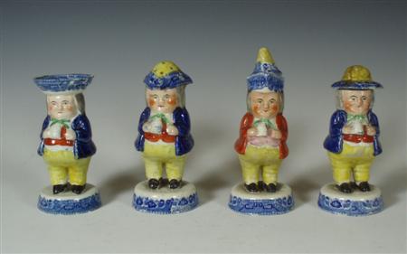 Appraisal: A group of four Scottish pottery 'Toby' figure condiment pots