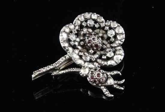 Appraisal: A Victorian gold and silver ruby and diamond set flower