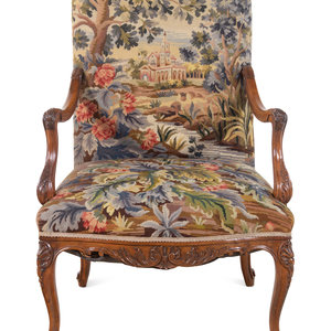 Appraisal: A R gence Style Walnut Fauteuil th Century with tapestry