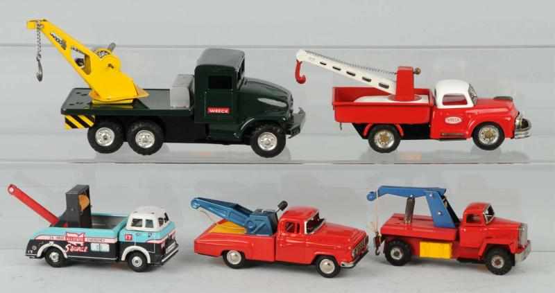 Appraisal: Lot of Tin Litho Wrecker Truck Friction Toys Description Japanese