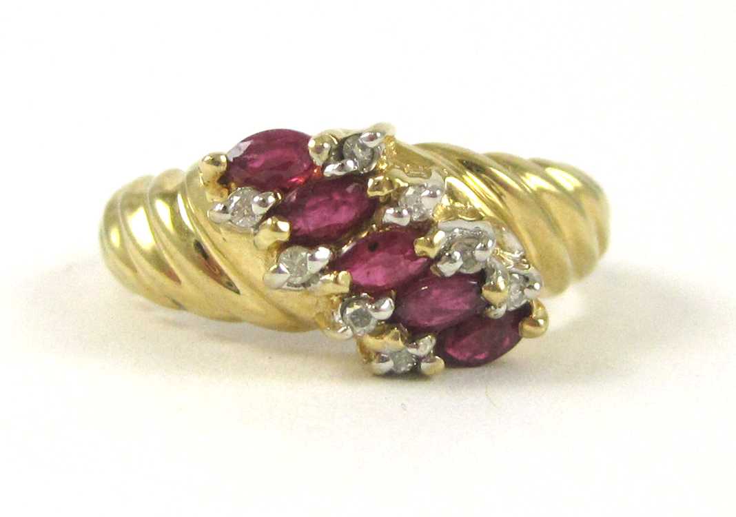 Appraisal: RUBY DIAMOND AND FOURTEEN KARAT GOLD RING set with eight