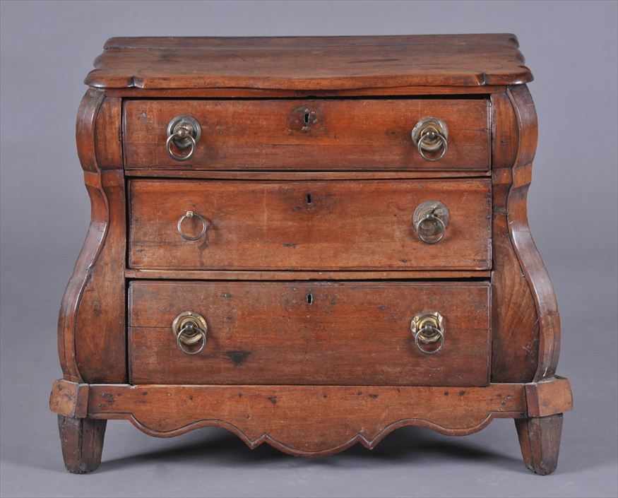 Appraisal: DUTCH ROCOCO CARVED OAK BOMB CHEST OF DRAWERS The shaped