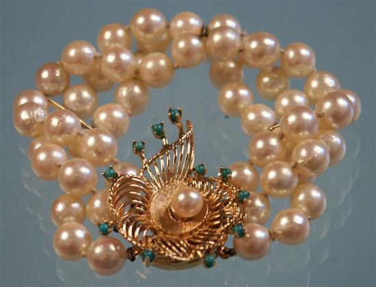 Appraisal: TRIPLE STRAND CULTURED PEARL BRACELET with a K yellow gold