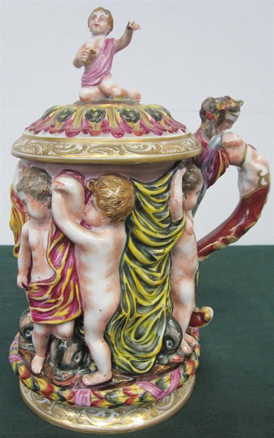 Appraisal: FRENCH PORCELAIN TANKARD Lidded with high relief putti and dolphins