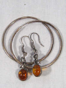 Appraisal: A pair of large silver hoop earrings together with a