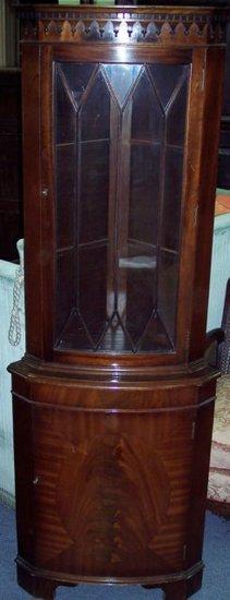 Appraisal: A th Century mahogany bowfront standing corner cupboard with astragal