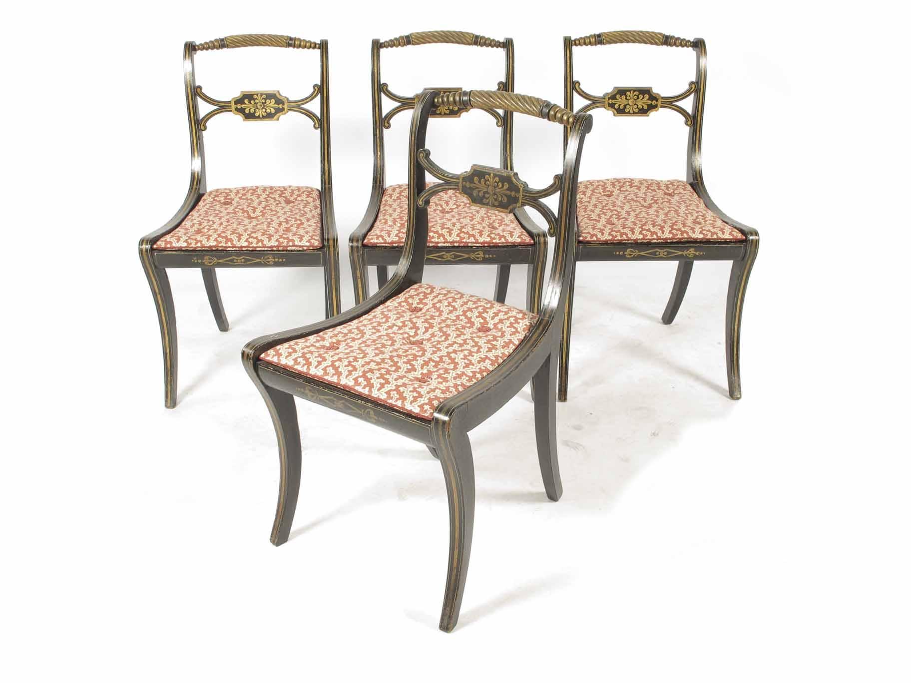 Appraisal: A set of four Regency ebonised and gilt side chairs