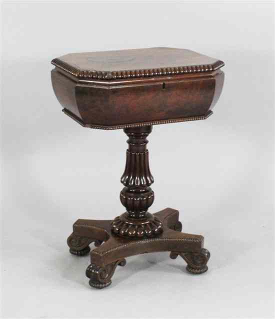 Appraisal: A George IV mahogany teapoy with a gadrooned column on