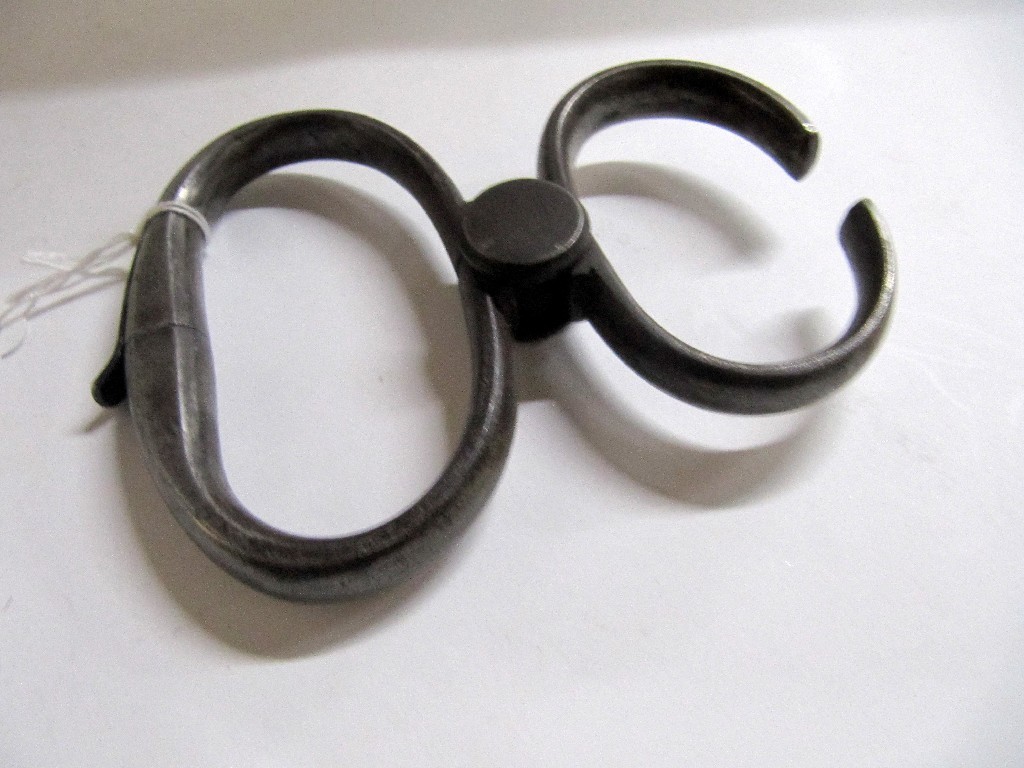 Appraisal: A pair of Hiatt restraining cuffs