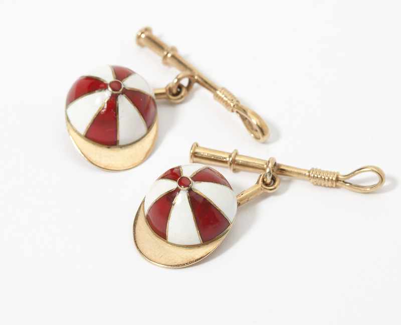 Appraisal: K gold each with a red and white enamel jockey