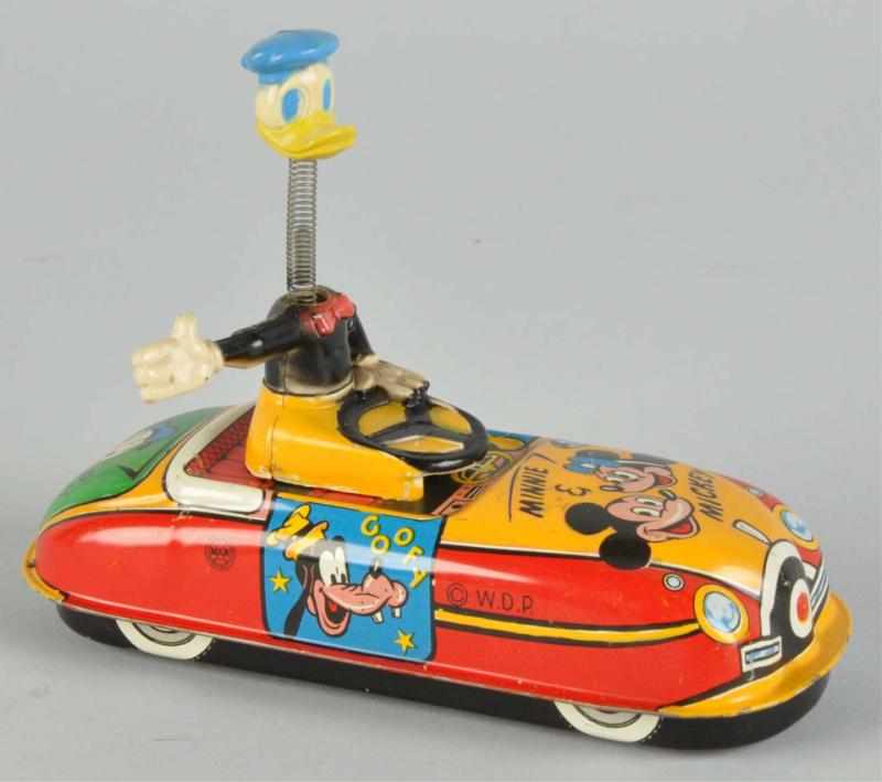 Appraisal: Tin Marx Disney Donald Duck Auto Prototype Toy Description American