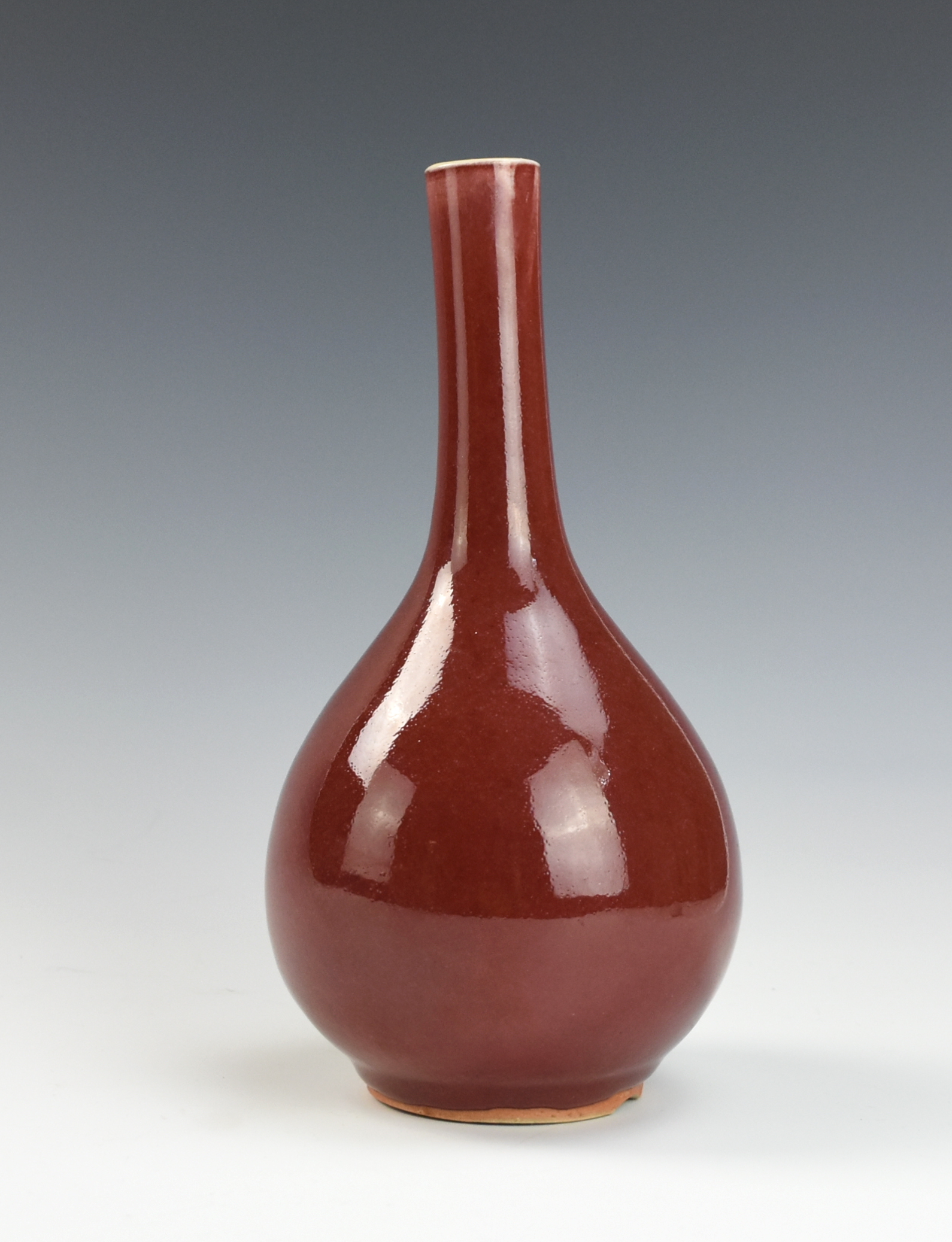 Appraisal: CHINESE RED GLAZED VASE TH C Chinese the tall pear-shaped