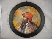 Appraisal: A ceramic tondo of a bearded man with red hat