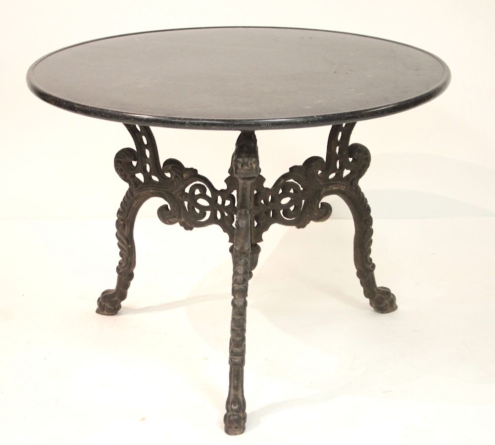 Appraisal: Round Black Marble Top on Antique Iron Lion Base the