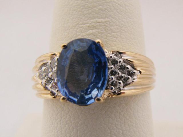 Appraisal: Lady's K YG oval tanzanite diamond ring size