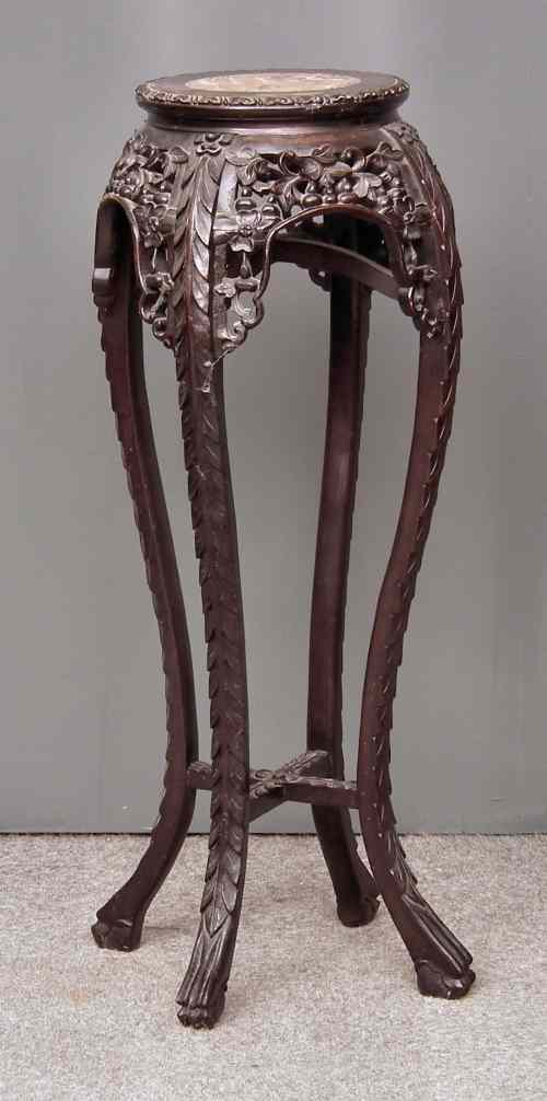 Appraisal: A Chinese rosewood circular jardiniere stand the top inset with