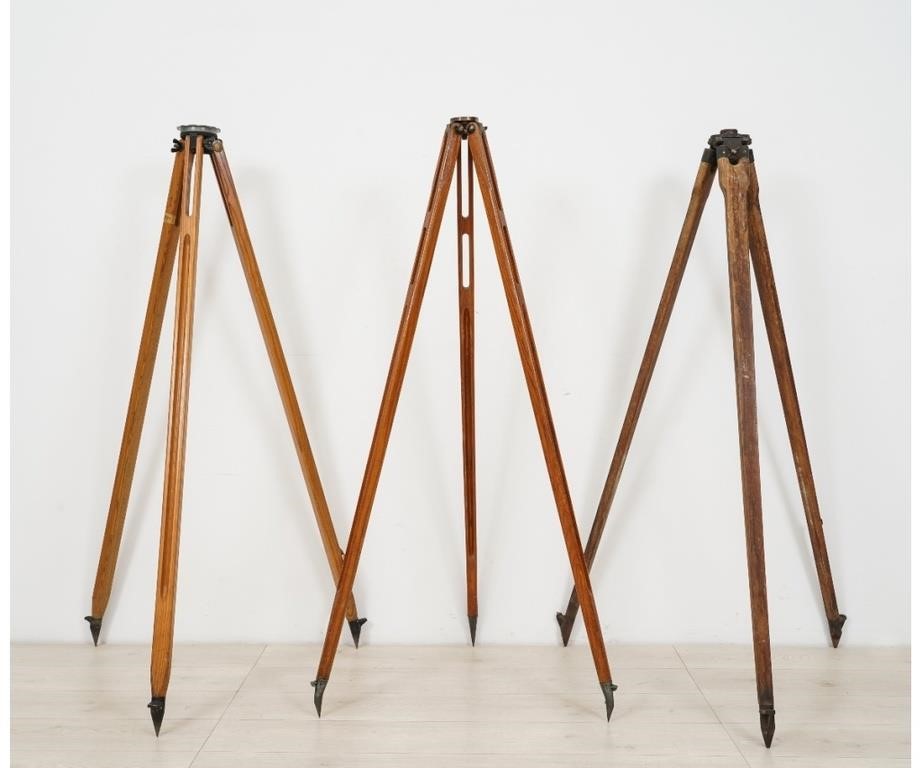 Appraisal: Three wooden transit tripods to include a Dietzgen and two