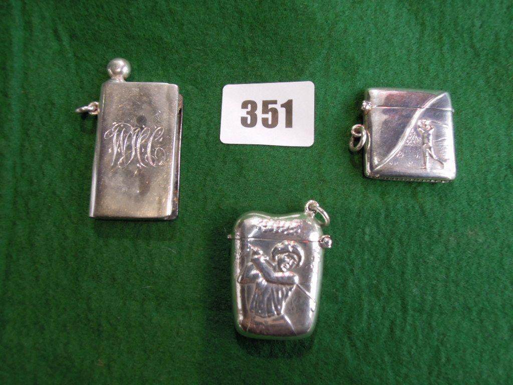 Appraisal: Two silver vestas each bearing a golfer one male and