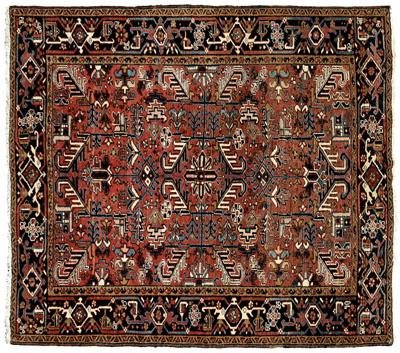 Appraisal: Heriz rug repeating designs on brick red field blue borders