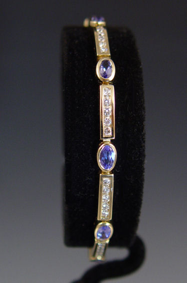 Appraisal: K TANZANITE DIAMOND BRACELET K yellow gold bracelet contains ten